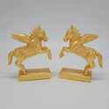 Front angle perspective showing a paired mirror display of the decorative gold finish solid brass winged horse figurines