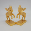 45-degree angle profile showcasing the diamond-weave saddle pattern and intense mirror-gold luster lines on the paired horse figures