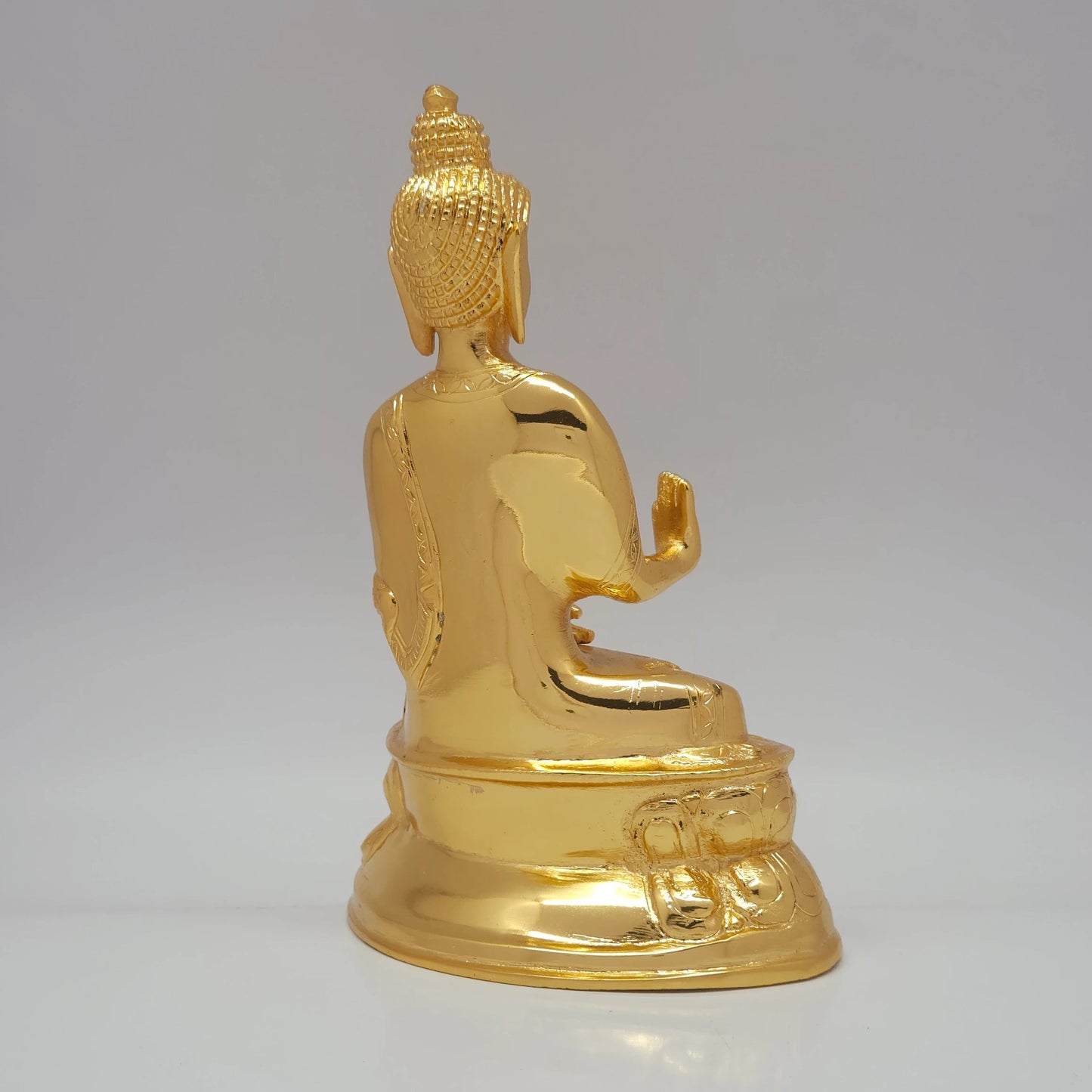 Rear profile showcasing the fluid robe folds and flawless mirror-gold luster of the 1.75kg luxury decorative brass sculpture in 45-degree angle