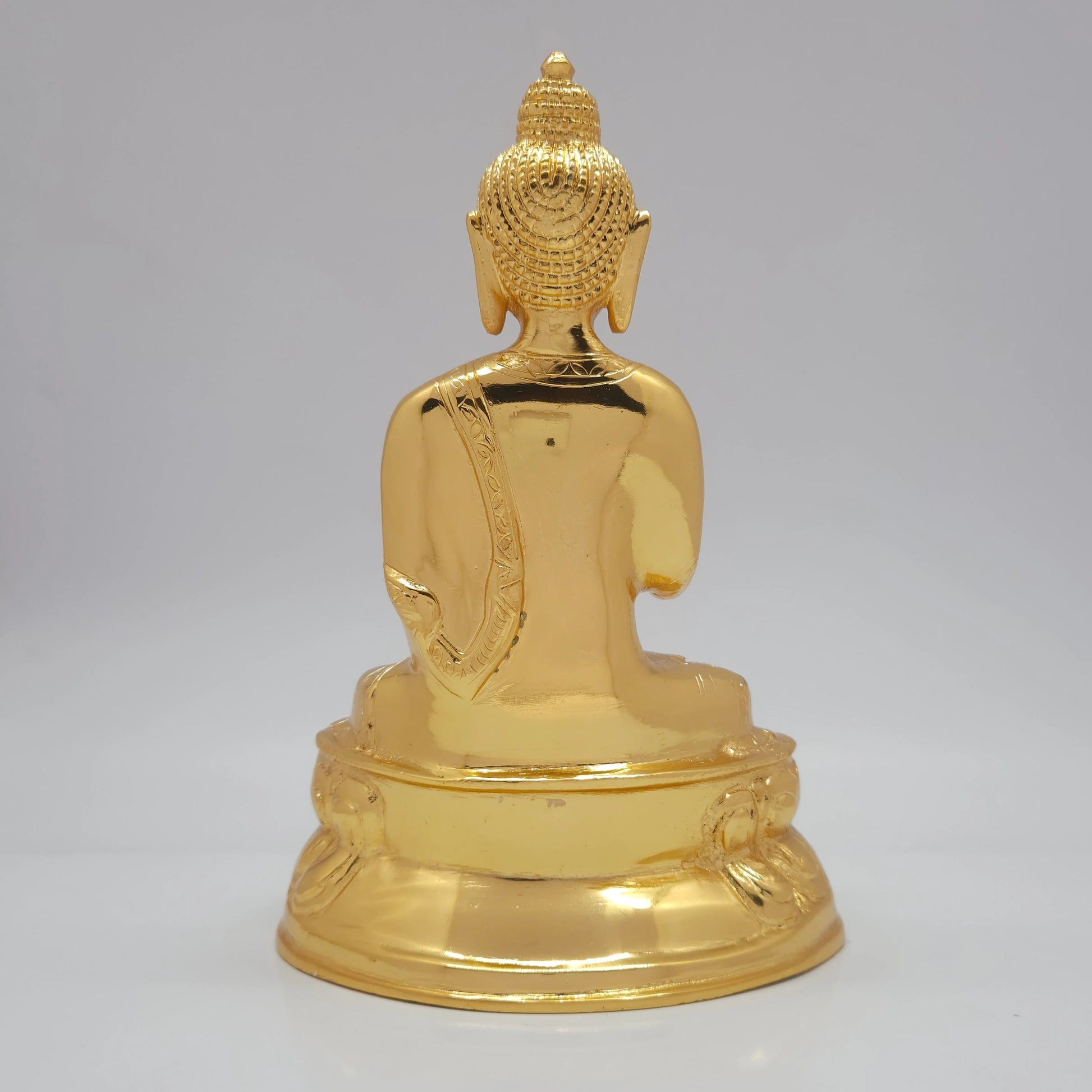 Rear profile showcasing the fluid robe folds and flawless mirror-gold luster of the 1.75kg luxury decorative brass sculpture