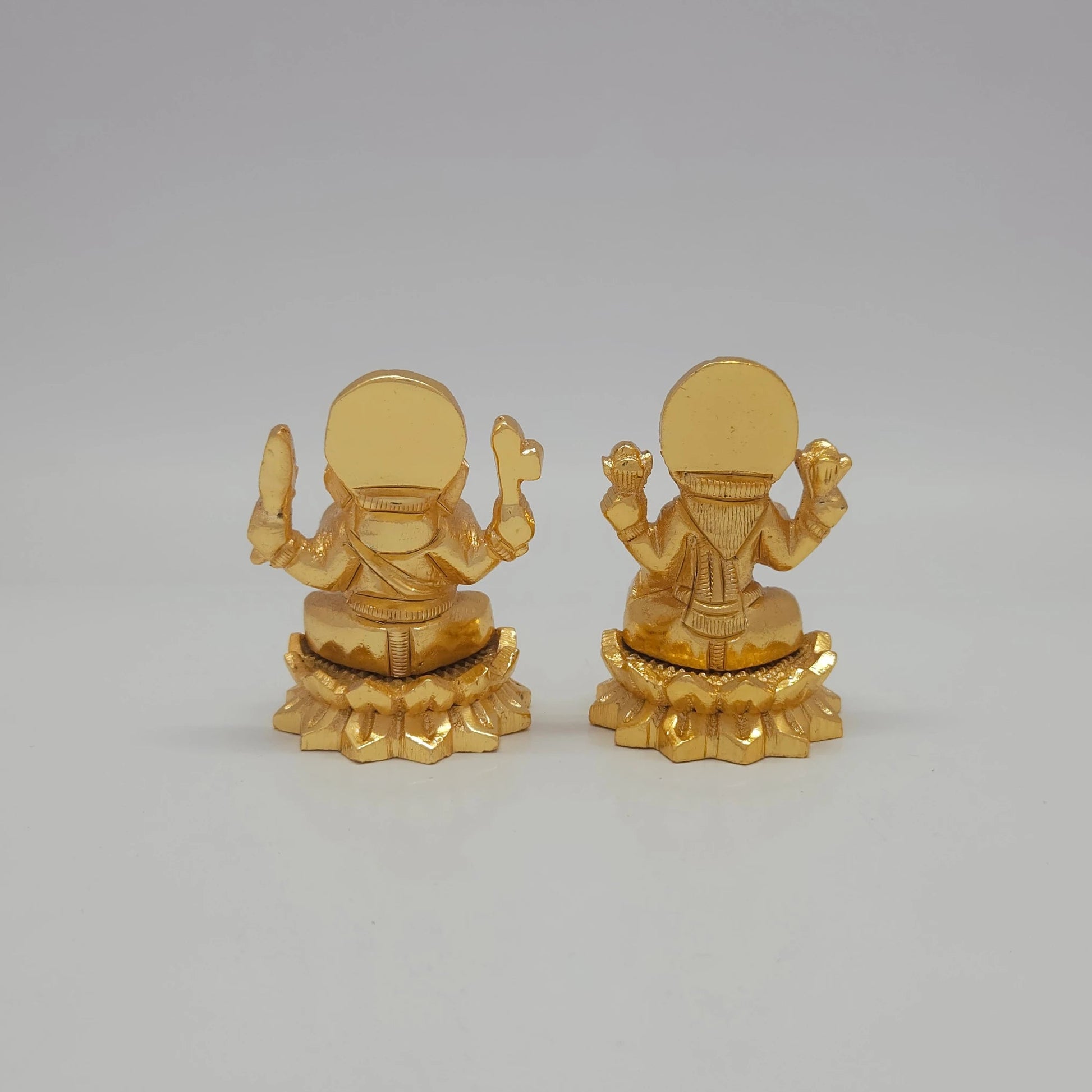 Rear view showcasing the detailed back engraving of the 5cm gold powder-coated decorative brass Ganesha statue from sriswaminathan.com