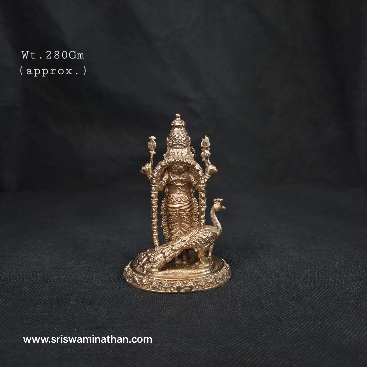 Close-up of Murugan Panchaloha Statue four hands — Vel, Trishul Chaturbhuja form detail, handcrafted in Kumbakonam
