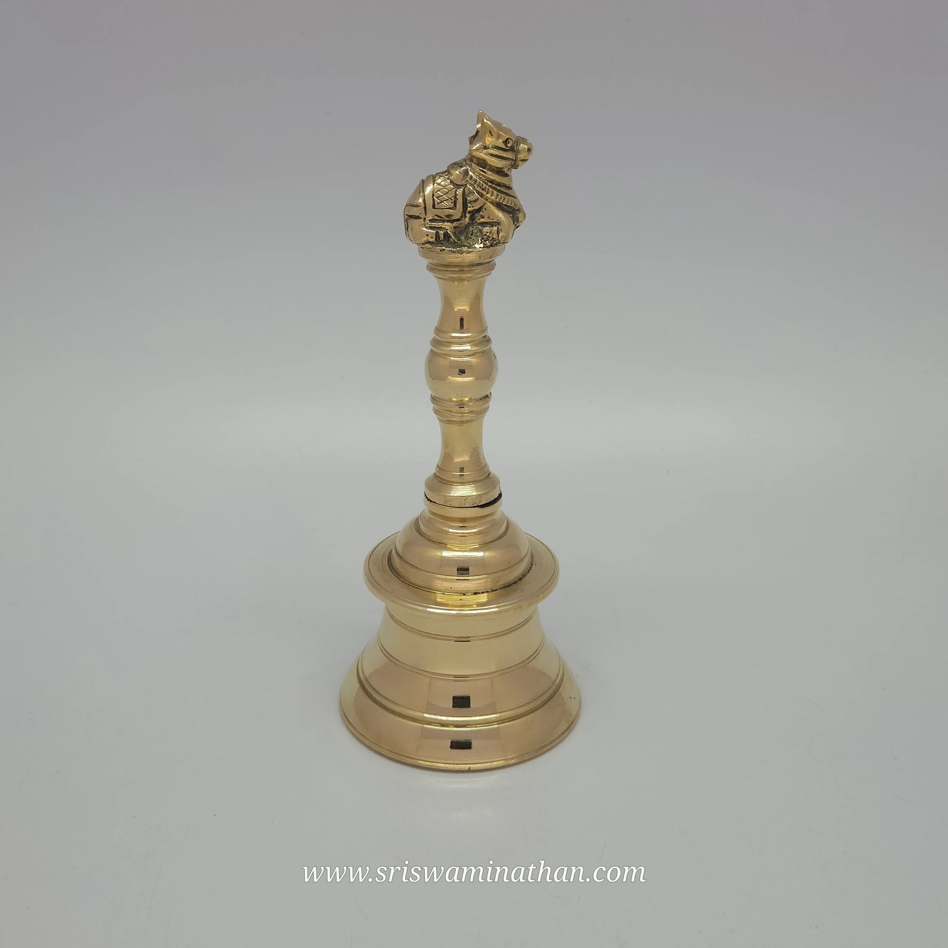 Side view of Nandhi brass bell showcasing traditional temple design and divine sound quality