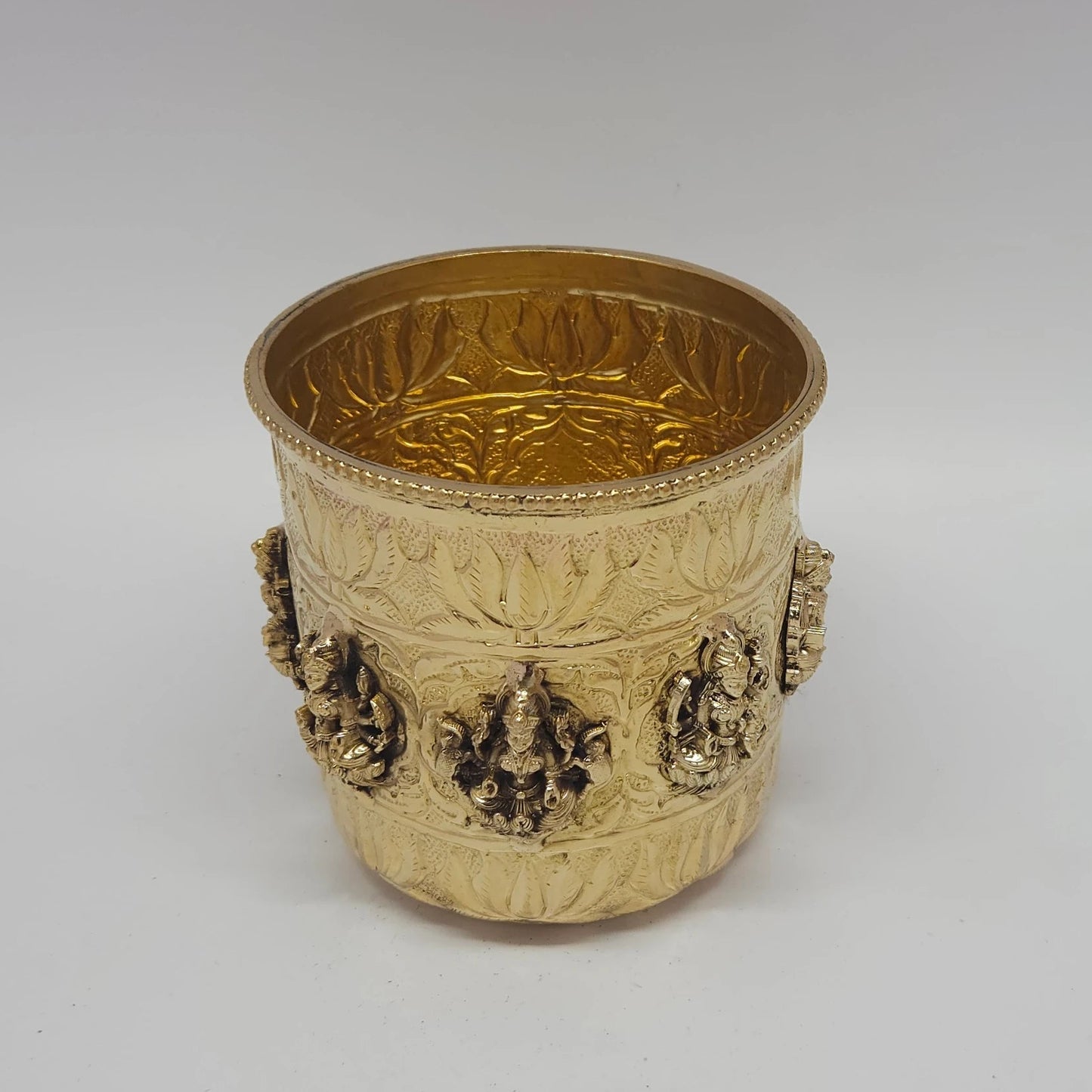 Scale photograph of the heavy-weight cylindrical brass Gangalam patra indicating its sturdy base, rim diameter, and height specifications for buyers checking ritual water storage capacity.