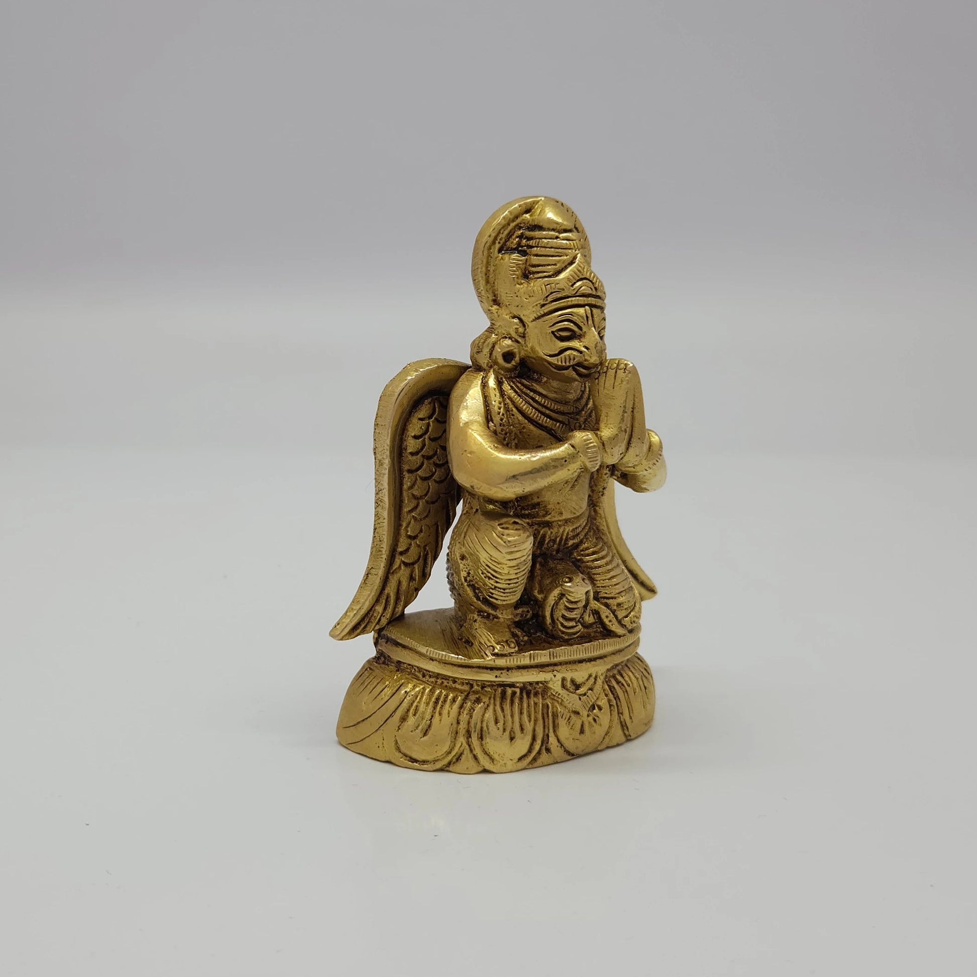 Premium Antique Brass kneeling Lord Garudan statue 3.5 inch 9cm 45 degree front left corner view highlighting dark contrast shading