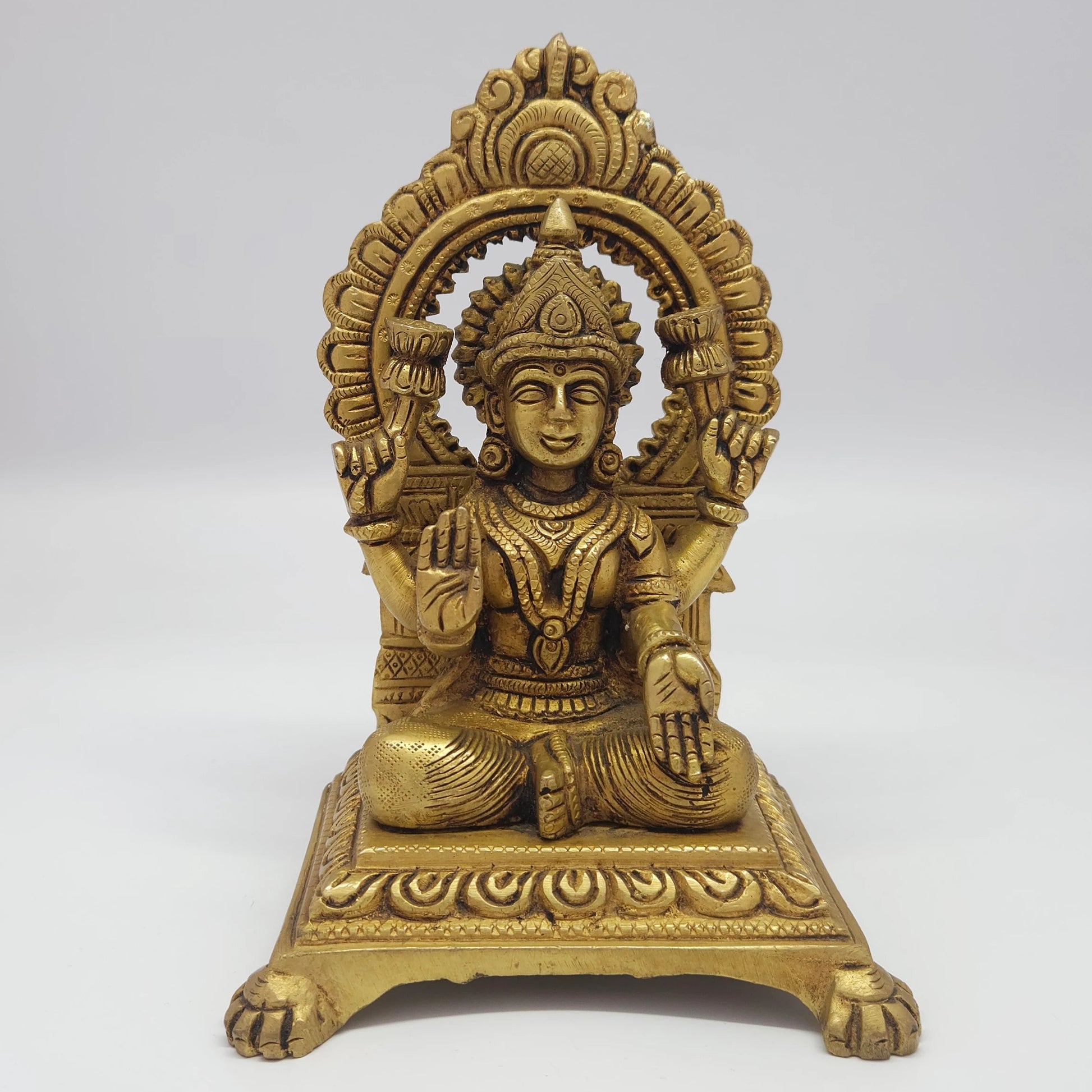 Premium Antique Brass seated Alamelu Mangai Padmavathi Devi statue with integrated prabhavali arch 18.5cm height front profile view clarifying identical names size guide