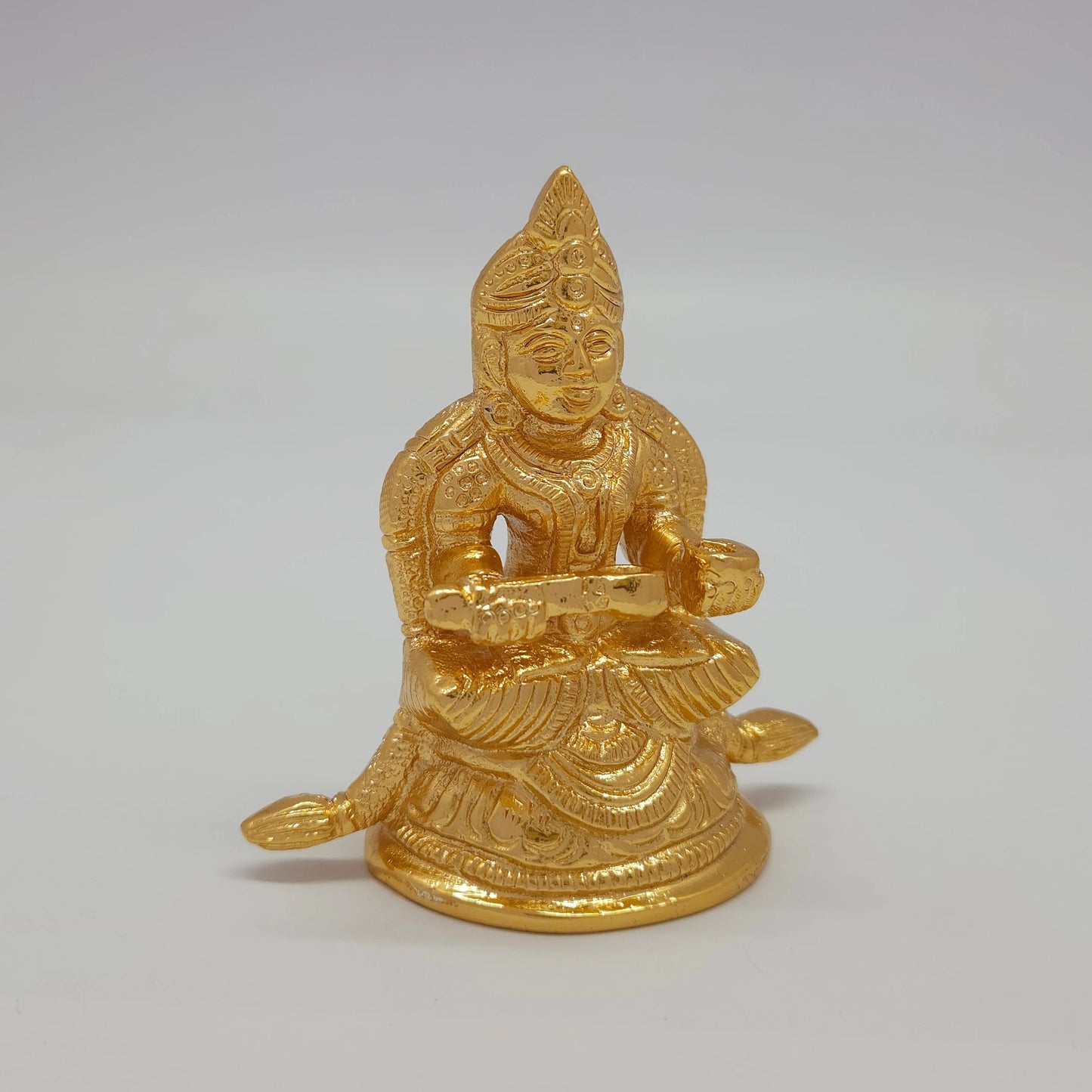 Premium Brass Goddess Annapoorani statue 3 inch 8.5cm 45-degree front right corner view focusing on extended peedam with ladle details