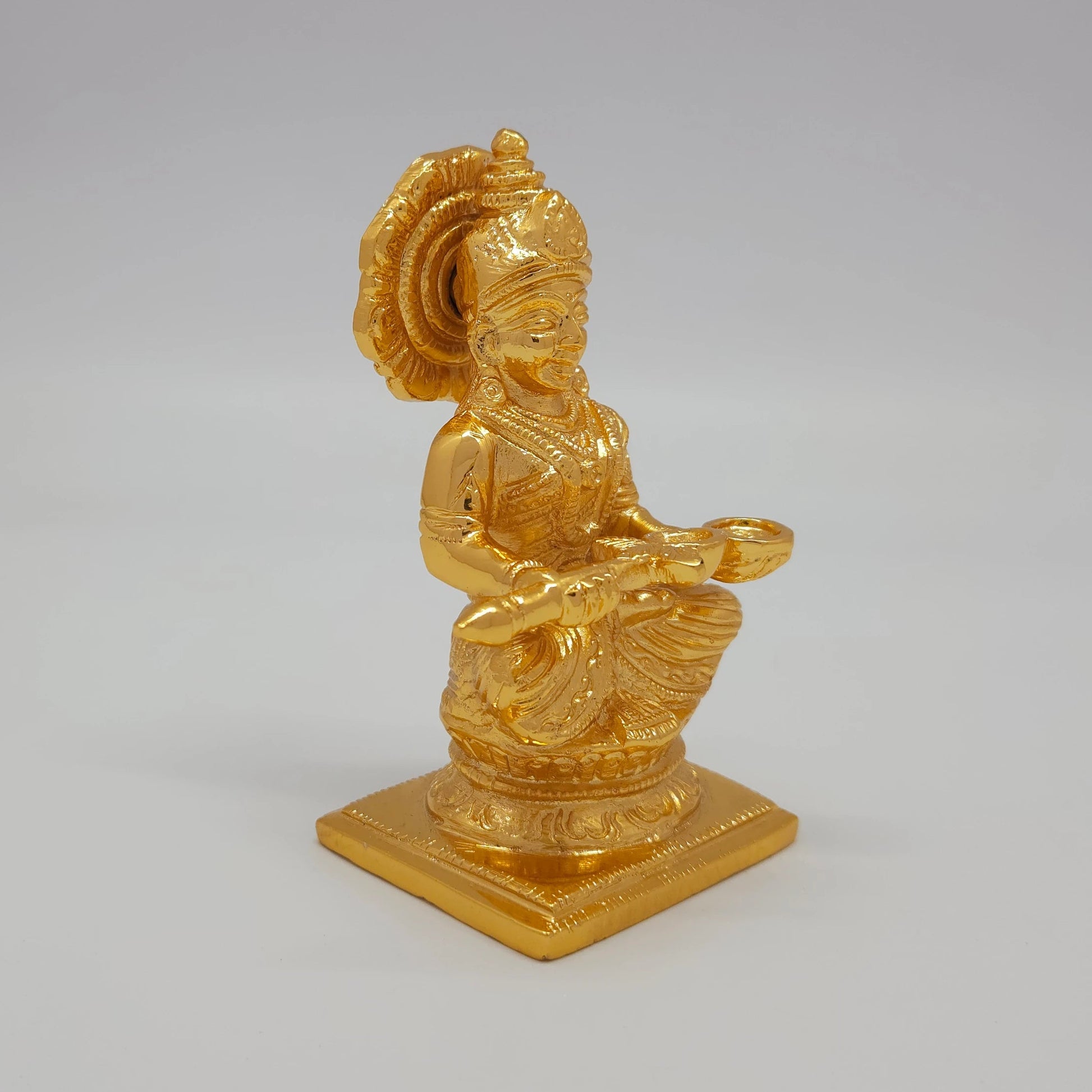 Premium Brass Goddess Annapoorani statue 5-inch 12cm 45-degree front right corner view focusing on double tiered square base details
