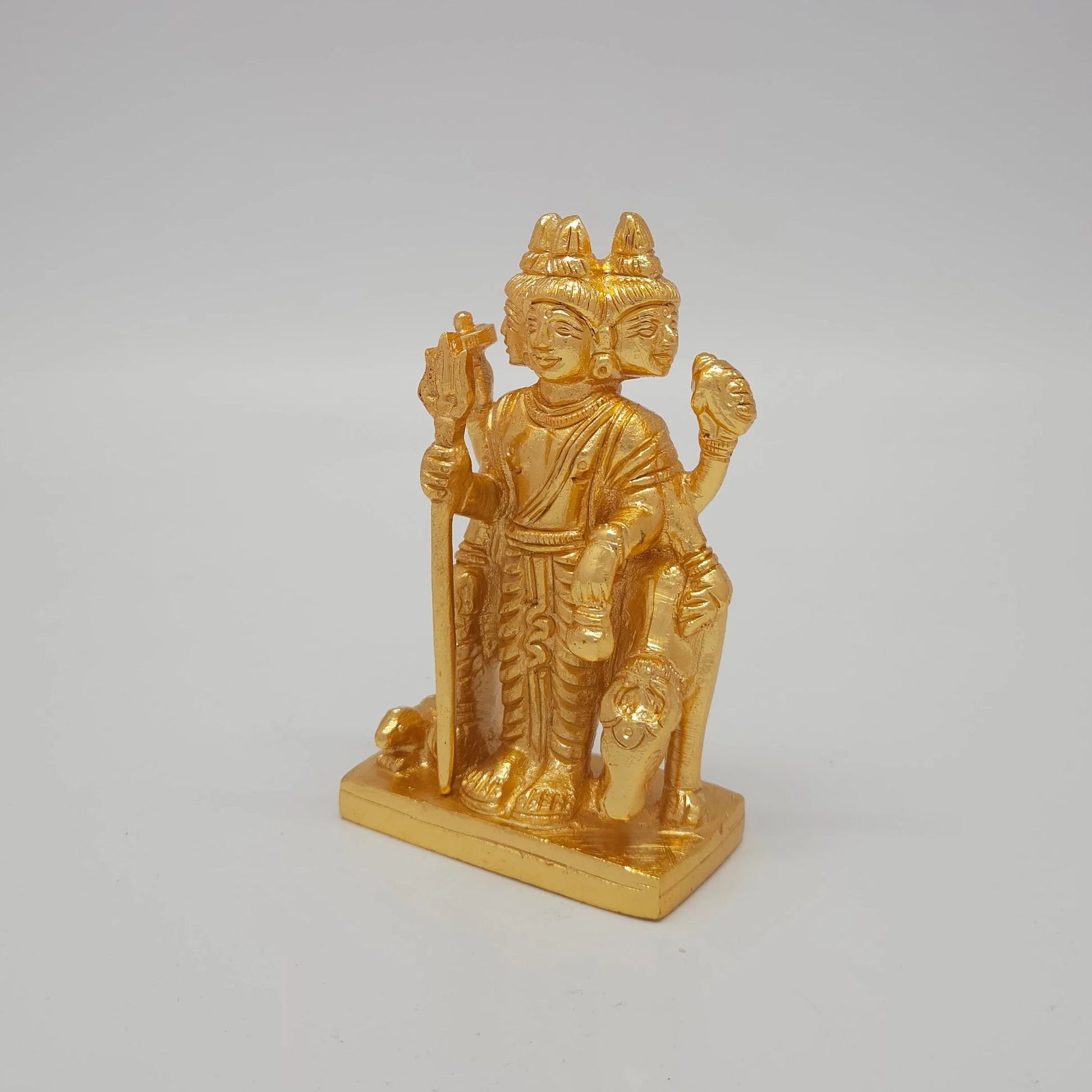 Premium Brass Lord Dattatreya statue 4-inch 11cm height 45-degree angle shot corner pose view highlighting integrated Kamadhenu cow head detail