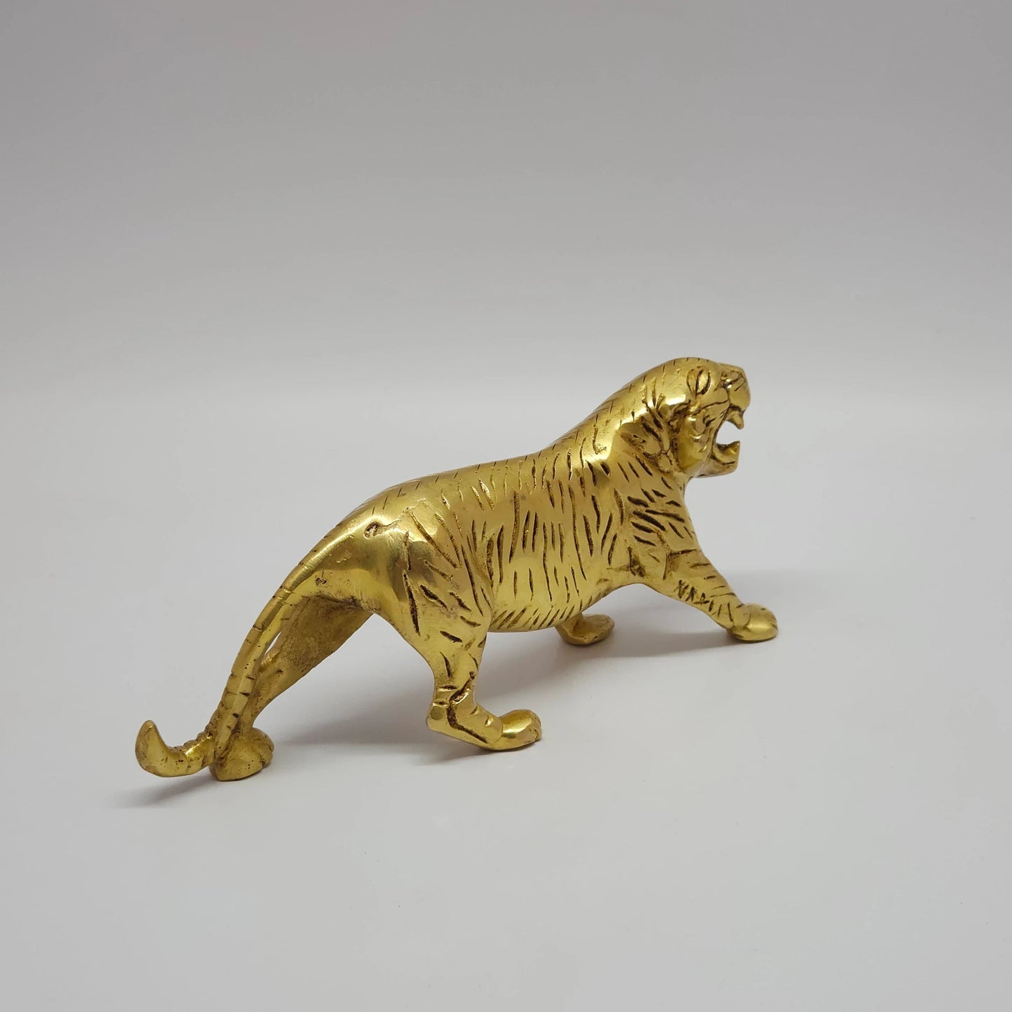 Premium Brass tiger sculpture 20cm back rear view showing casting symmetry and curved tail