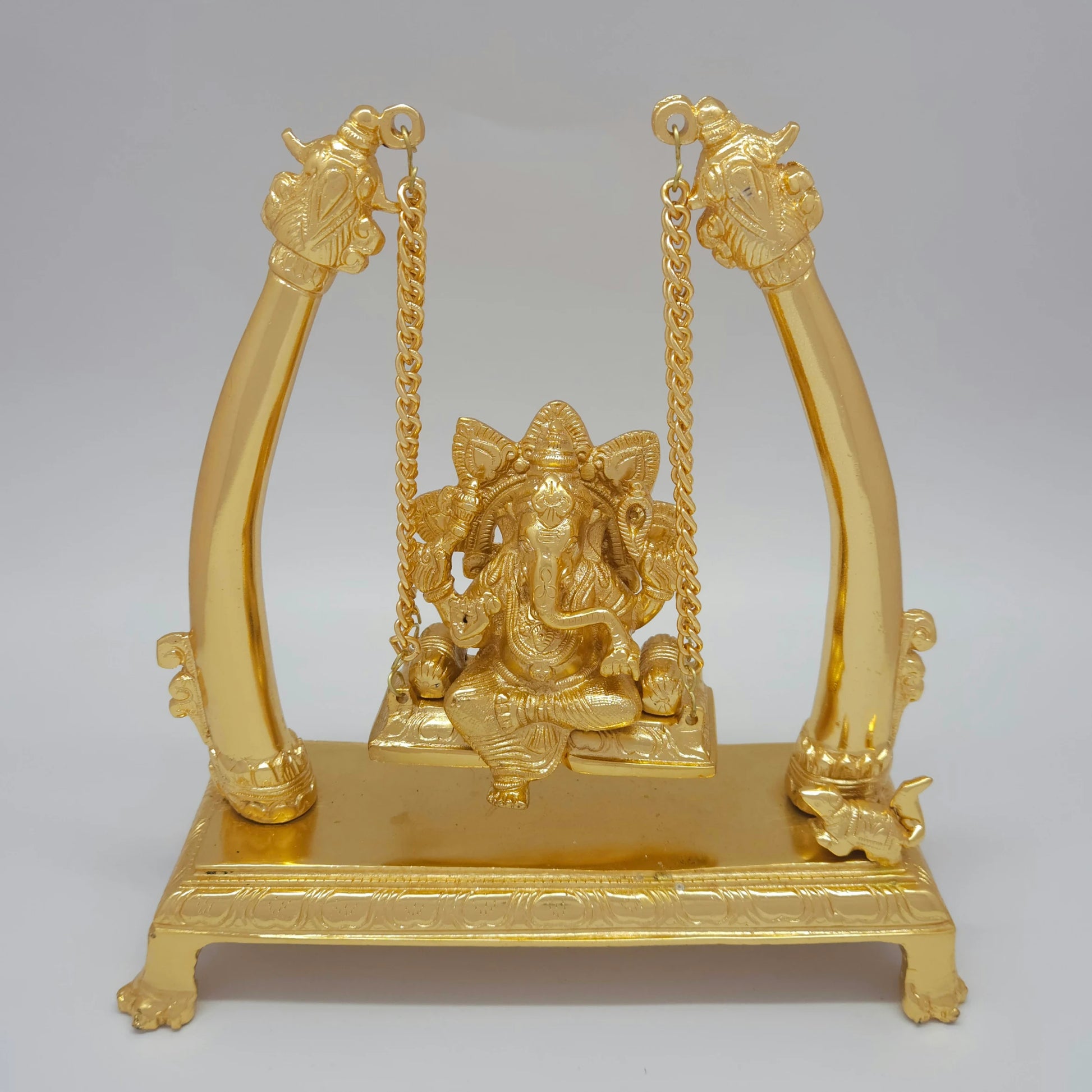 Front view of the Premium Brass Ganesha Jhula Seated Swing Statue with Mirror-Polished Royal Frame measured at 27 cm by Sri Swaminathan and Co