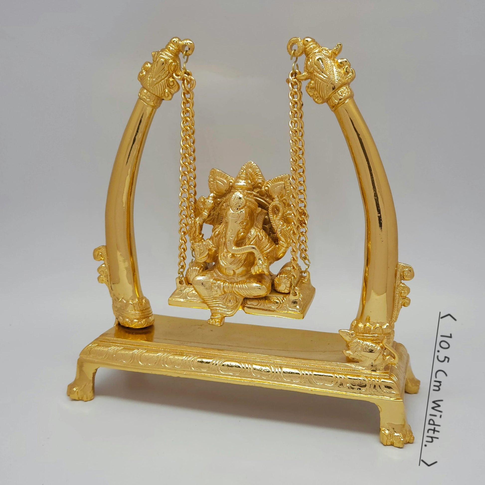 Premium Brass Ganesha Jhula swing statue 4 inch 45 degree left side angle profile view showing smooth mirror polish