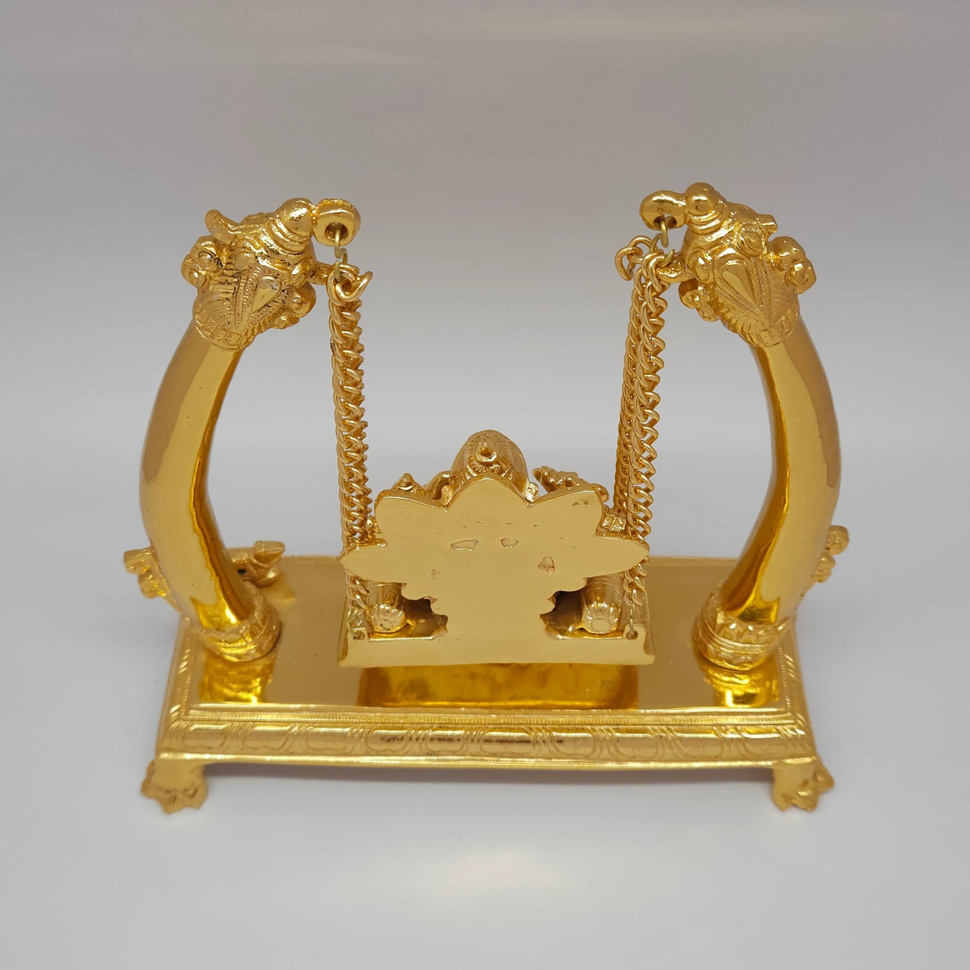 Premium Brass Ganesha Jhula swing statue top angle back view showing upper arch structure and hanging mechanism
