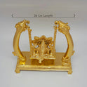 Premium Brass Ganesha Jhula swing statue top angle front view showing gold finish luster and base pedestal detailing