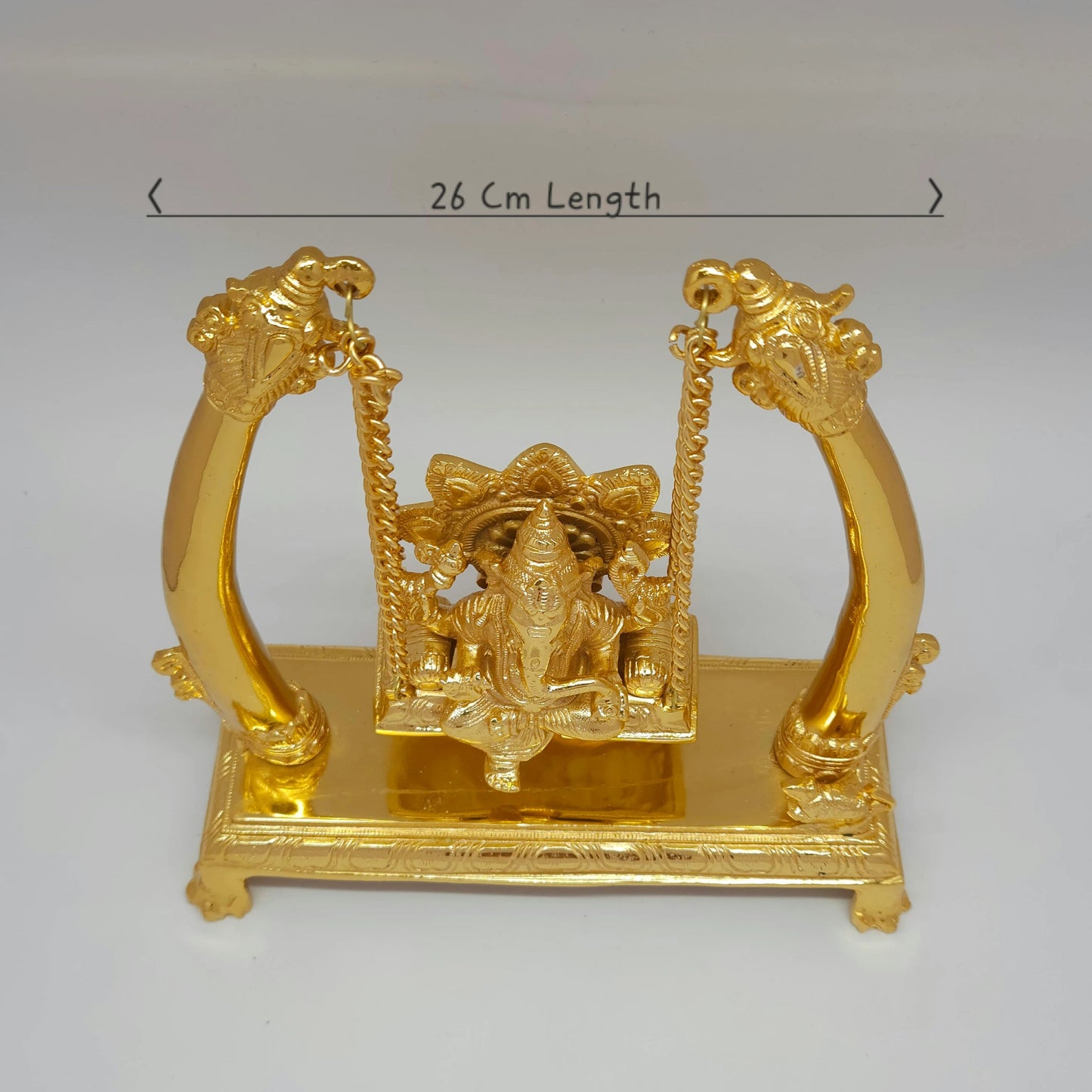 Premium Brass Ganesha Jhula swing statue top angle front view showing gold finish luster and base pedestal detailing