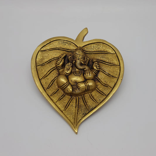  Front straight view of the 5.3 inch premium solid brass Ganesha on betel leaf wall hanging from Sri Swaminathan and Co stock showing the detailed antique finish layout.