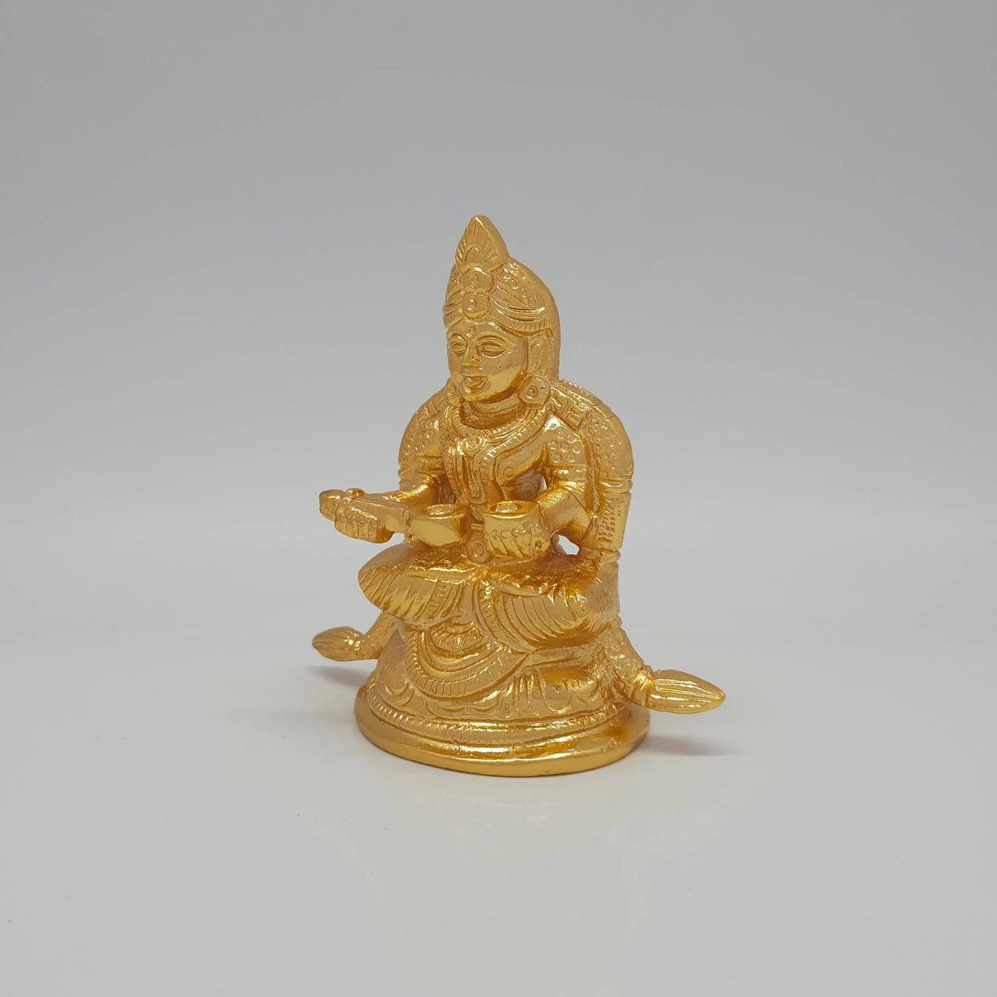 Premium Brass Goddess Annapoorani seated idol 3 inch 8.5cm height 45-degree front left view showing vessel pot detail extended peedam and sirachakra halo
