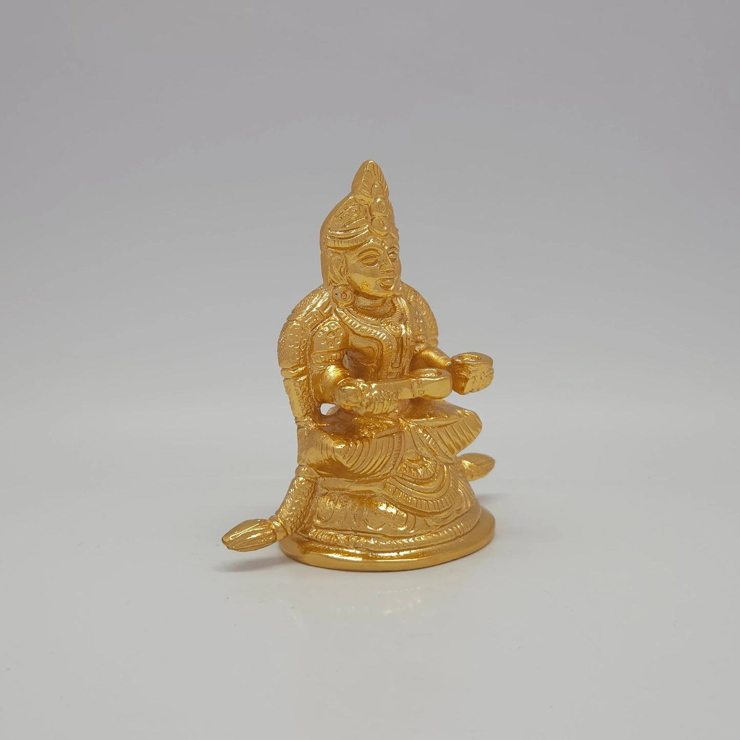 Premium Brass Goddess Annapoorani seated idol 3 inch 8.5cm height 45-degree front right view showing ladle detail extended peedam and flowing garland