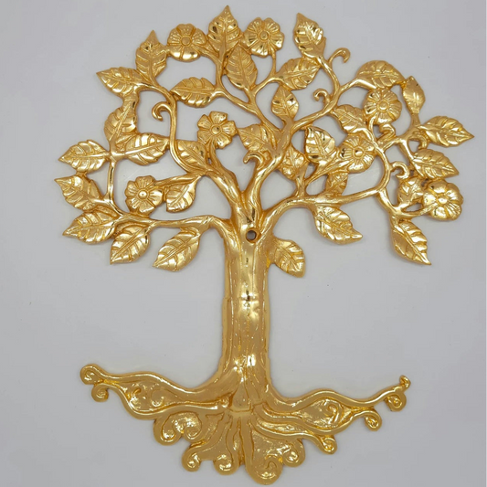 Close up macro shot of premium brass kalpavriksha tree wall panel showing chiseled leaves and flowers