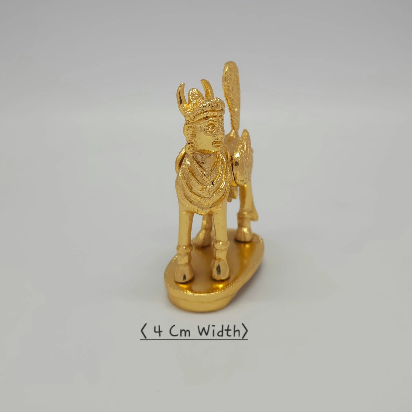 Premium Brass Kamadhenu cow statue facing right side angle view showing ornated jewel works 4cm depth