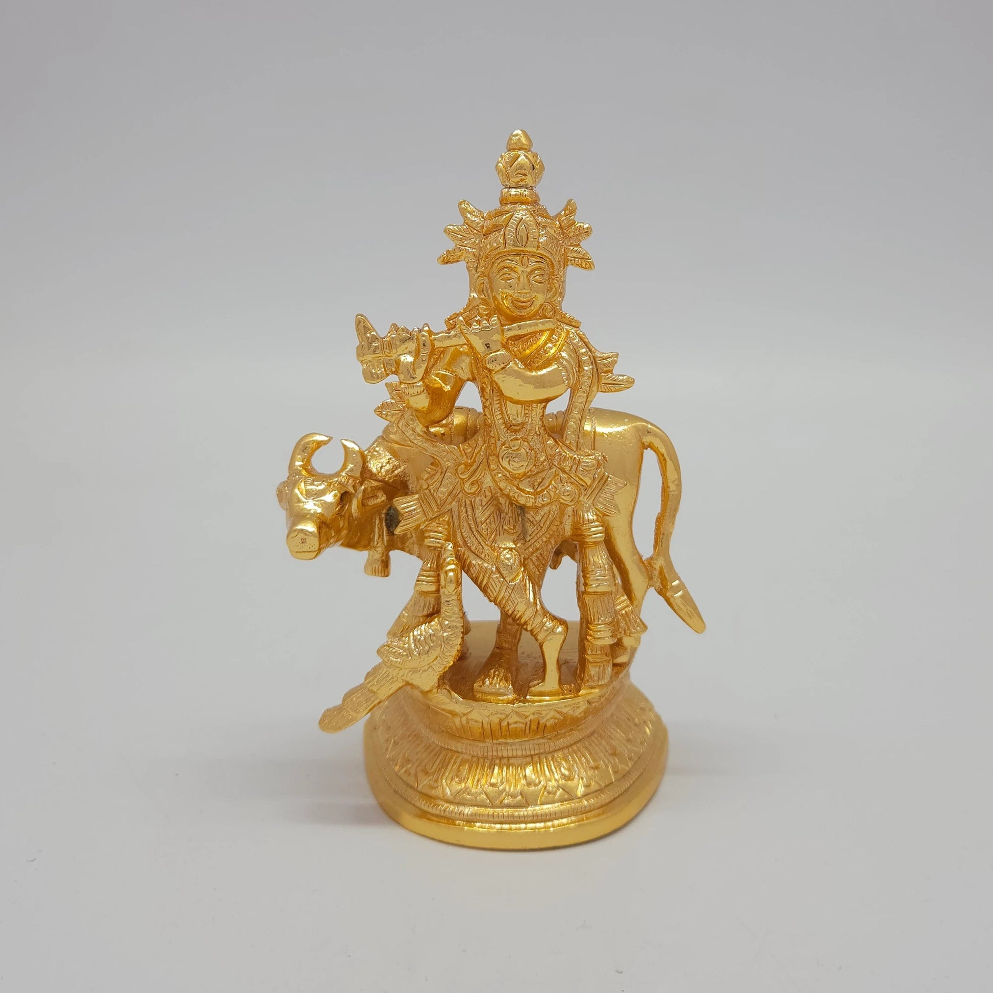 Premium Brass Lord Krishna statue with cow and peacock 13cm height front profile view glossy gold finish lifestyle decor gift size guide