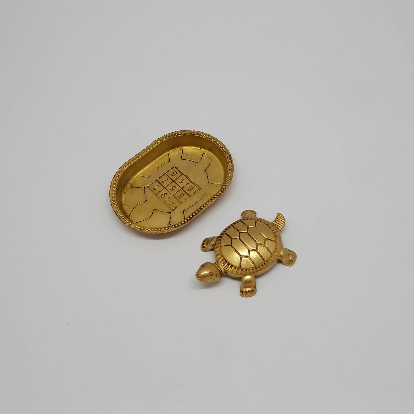 Premium Brass Kurma Tortoise with sacred numerology yantra plate 45 degree left side angle view