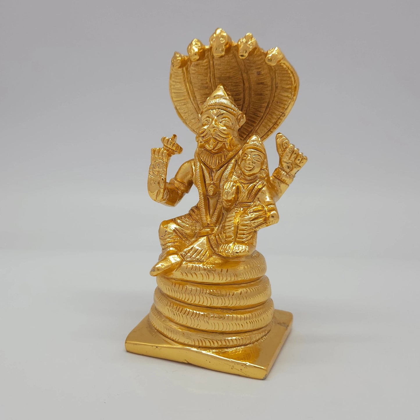 Premium Brass Lakshmi Narasimha statue 5 inch 13cm 45-degree front left corner view highlighting chiseled chakra and coiled snake base