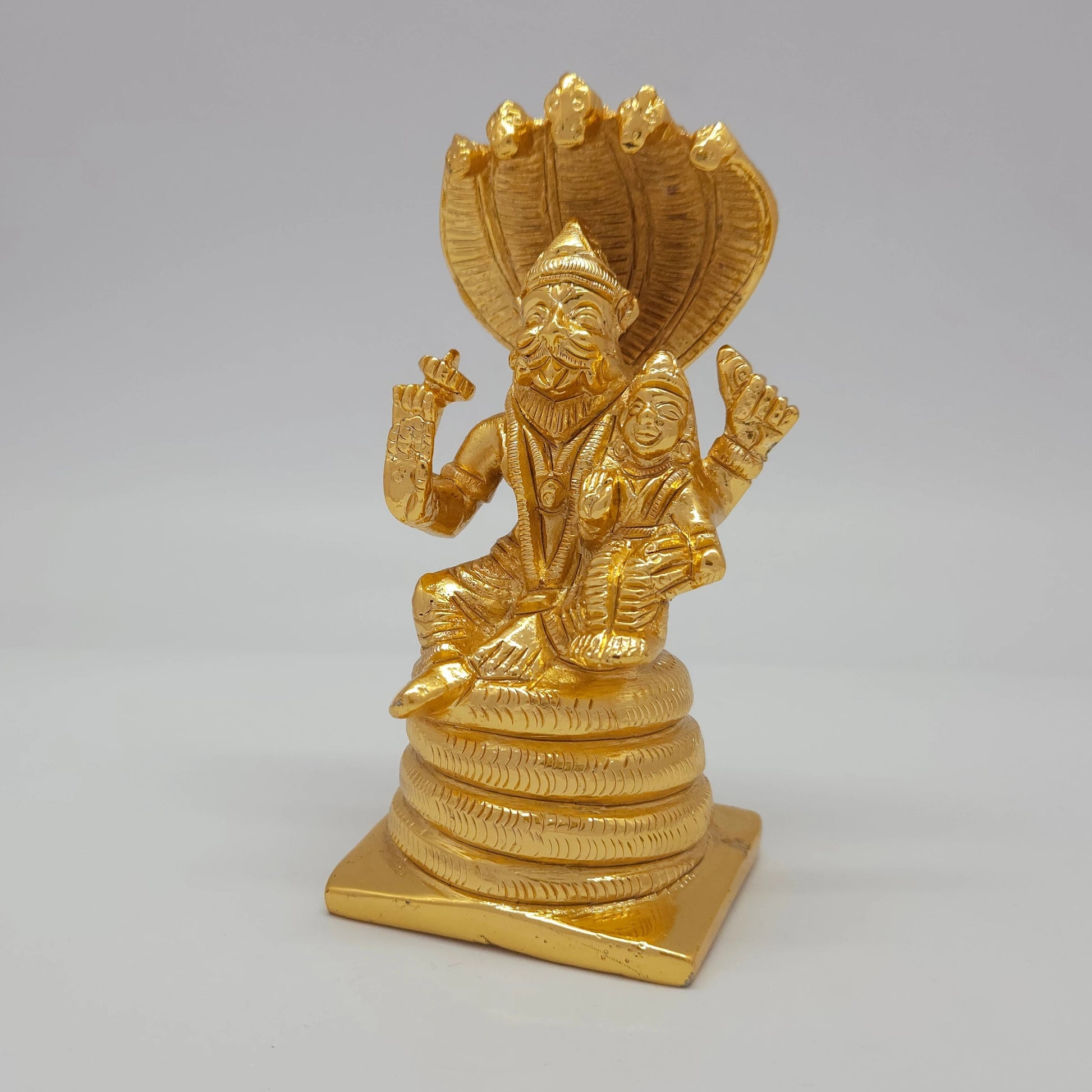Premium Brass Lakshmi Narasimha statue 5 inch 13cm 45-degree front left corner view highlighting chiseled chakra and coiled snake base