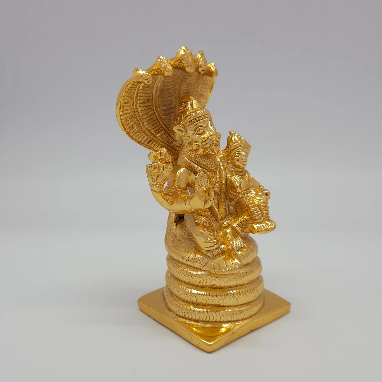 Premium Brass Lakshmi Narasimha statue 5 inch 13cm 45 degree front right corner view focusing on seated goddess lakshmi form