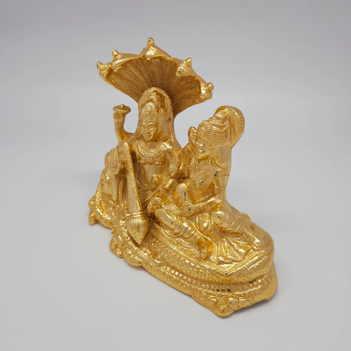 Premium Brass Lakshmi Narayana statue 8-inch 20cm 45-degree front right corner view focusing on goddess lakshmi seated posture near feet