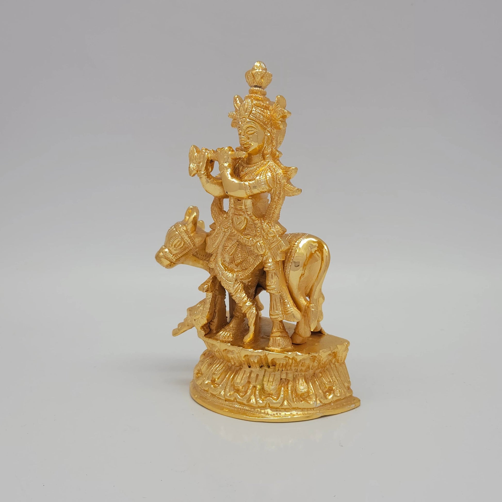 Premium Brass Lord Venugopal statue 17.5cm 45 degree front right corner view focusing on wide flute and cow head profile