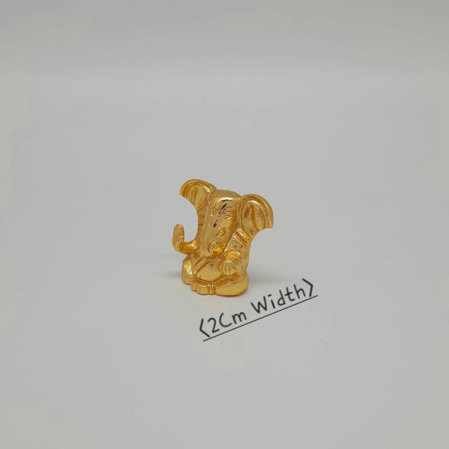 Premium brass miniature ganesha abstract murti 2cm depth gold polish 45 degree left side angle profile view