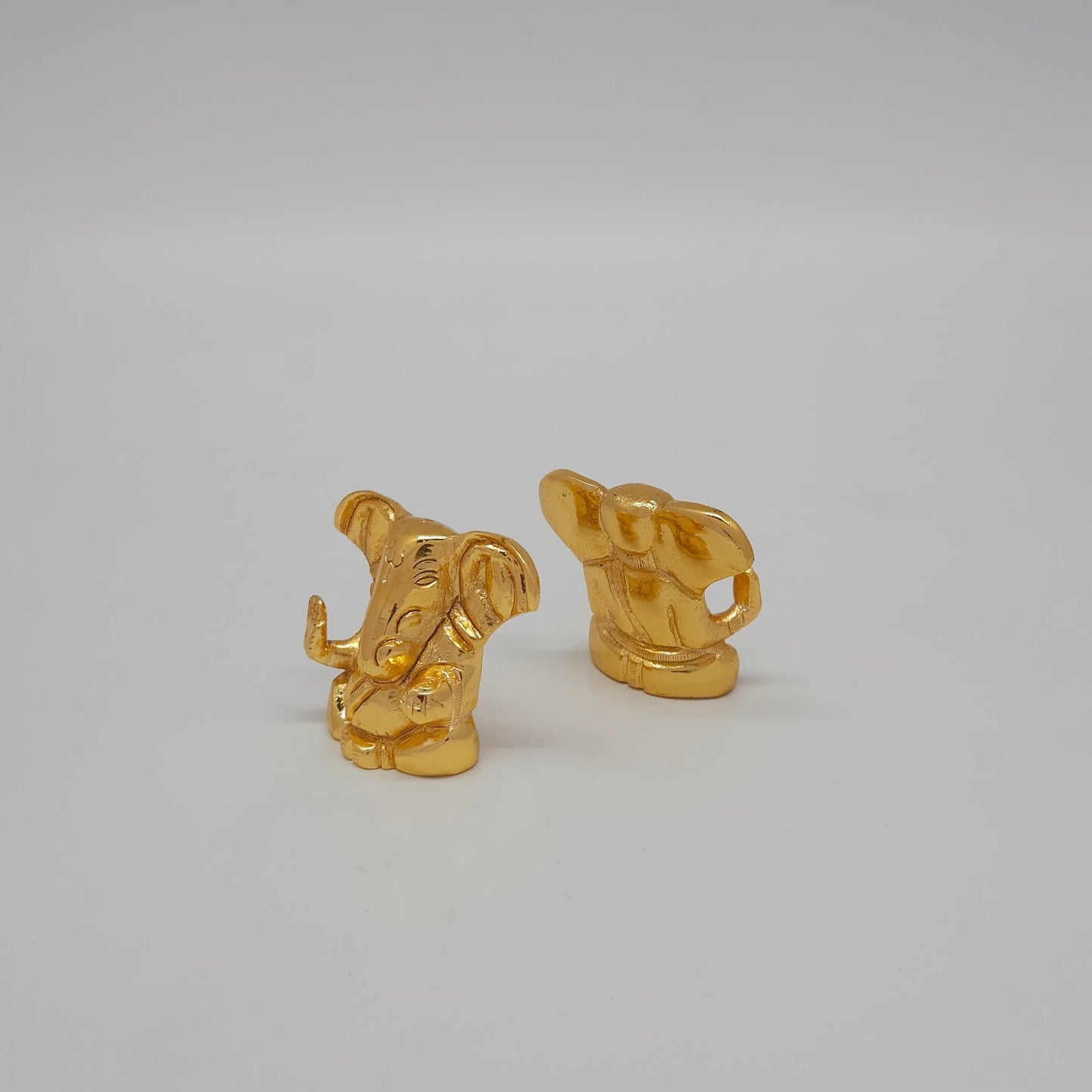 Premium brass miniature ganesha abstract murti 4cm mirror reflection style layout 45 degree left side angle profile
