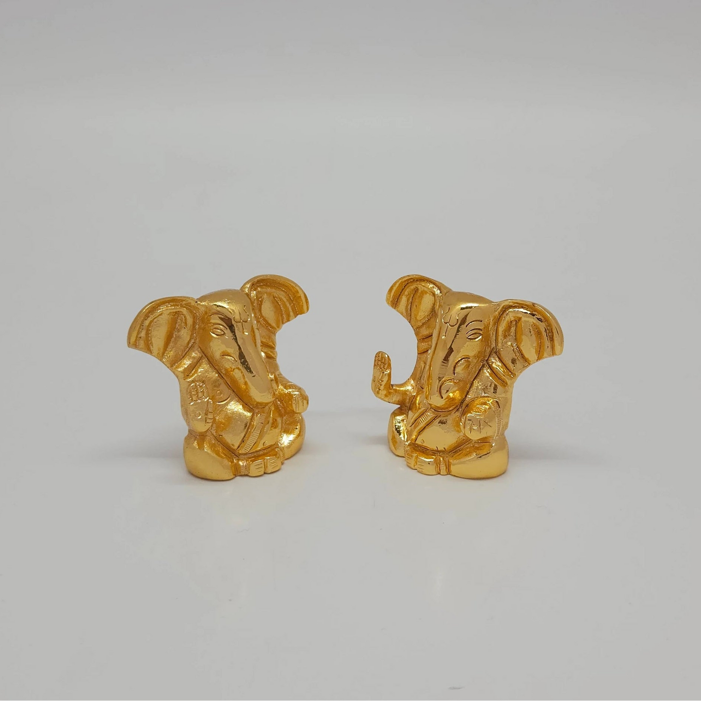 Premium brass miniature ganesha abstract murti 1.5 inch mirror reflection style layout high top angle overview