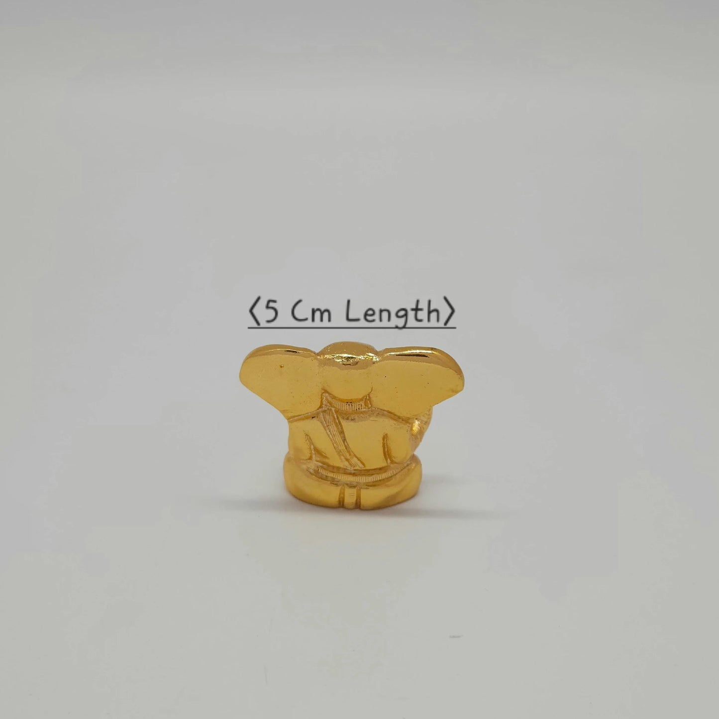 Premium brass miniature ganesha abstract murti 5cm length bottom view showing traditional hollow base casting