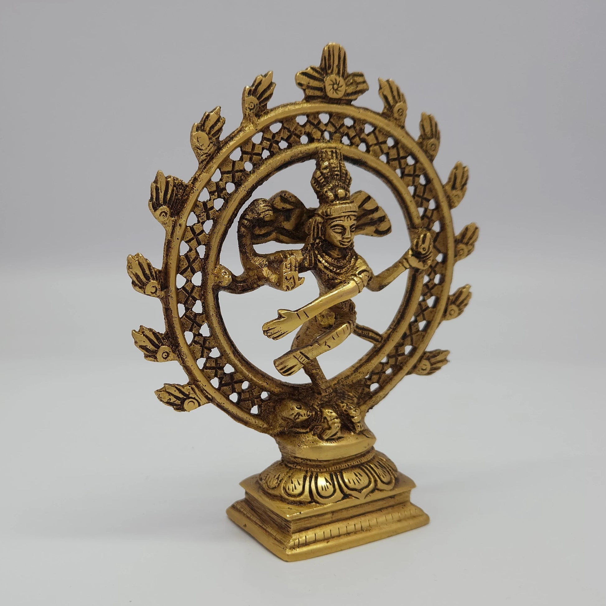 Premium Brass Lord Nataraja statue 6 inch 15cm 45 degree front left corner view highlighting damaru drum and circular halo grid