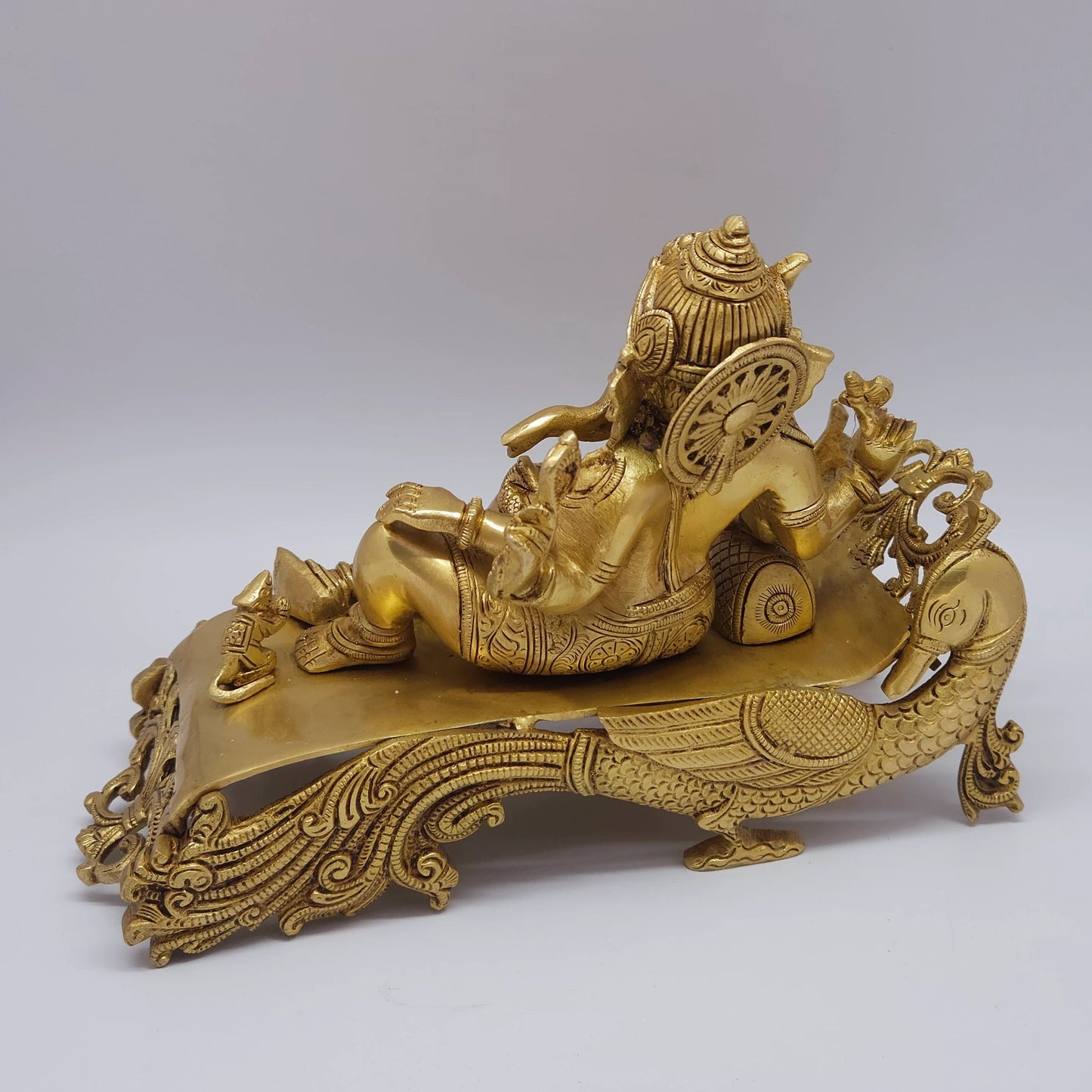 Premium Antique Brass reclining Ganesha statue 27cm length 45 degree rear right profile view showing symmetry of the antique shading lines