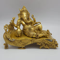 Premium Antique Brass reclining Ganesha statue 27cm length bottom profile view verifying heavy high density solid brass casting core