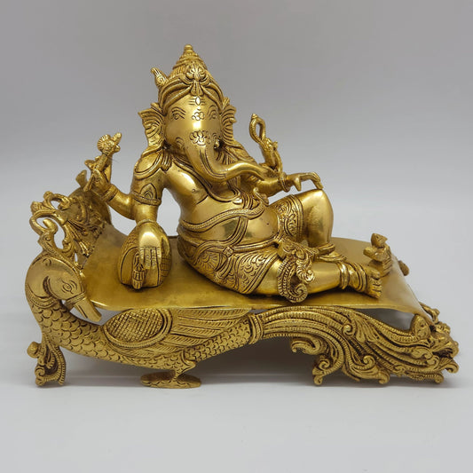 Premium Antique Brass reclining Ganesha statue 27cm length bottom profile view verifying heavy high density solid brass casting core