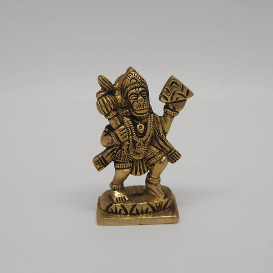 Front straight profile view of the 2.7 inch premium solid brass Sanjeevi Hanuman statue holding the mountain and mace with an antique look finish from Sri Swaminathan and Co stock.
