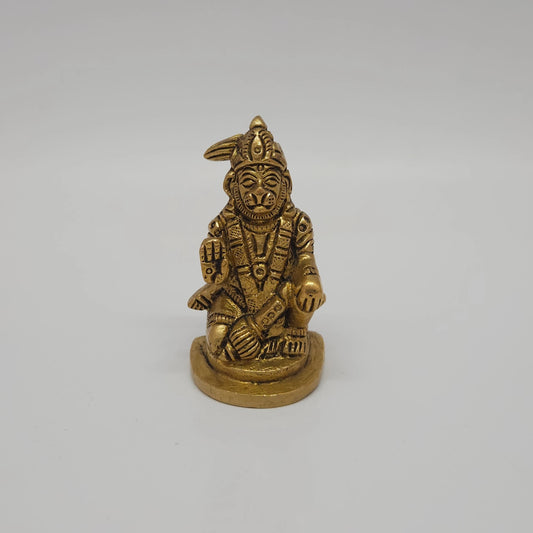 Front straight profile view of the 2.5 inch premium solid brass seated Abhaya Anjaneyar Hanuman statue showing the antique finish layout and blessing hand.