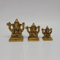  Front straight view showing the small, medium, and big size variations of the solid brass antique finish Chaturbhuja Vinayagar statue standing side by side.