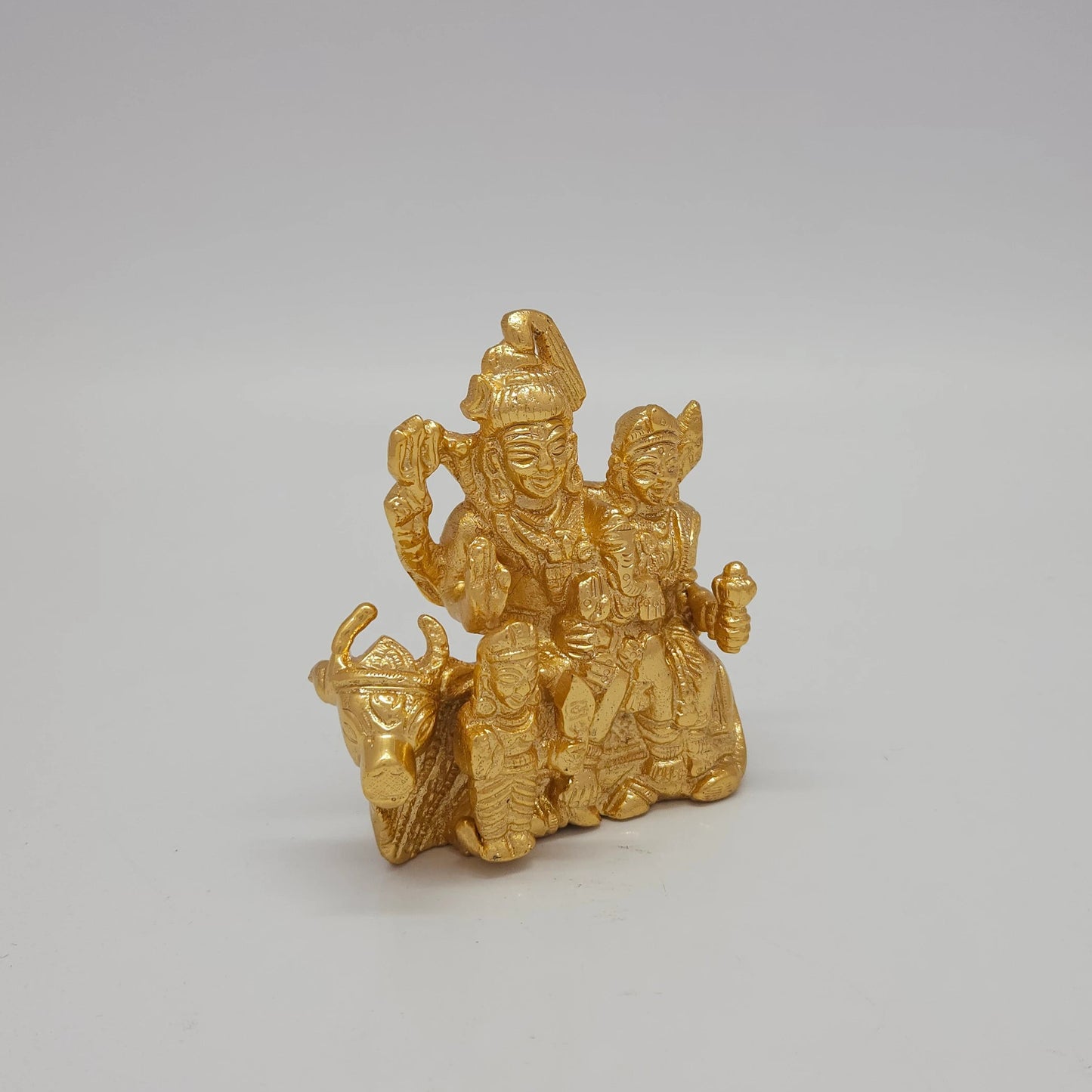 Premium Brass Shiva Parivar family statue 4 inch 9.5cm 45 degree front left corner view highlighting trishul and standing karthikeya murugan