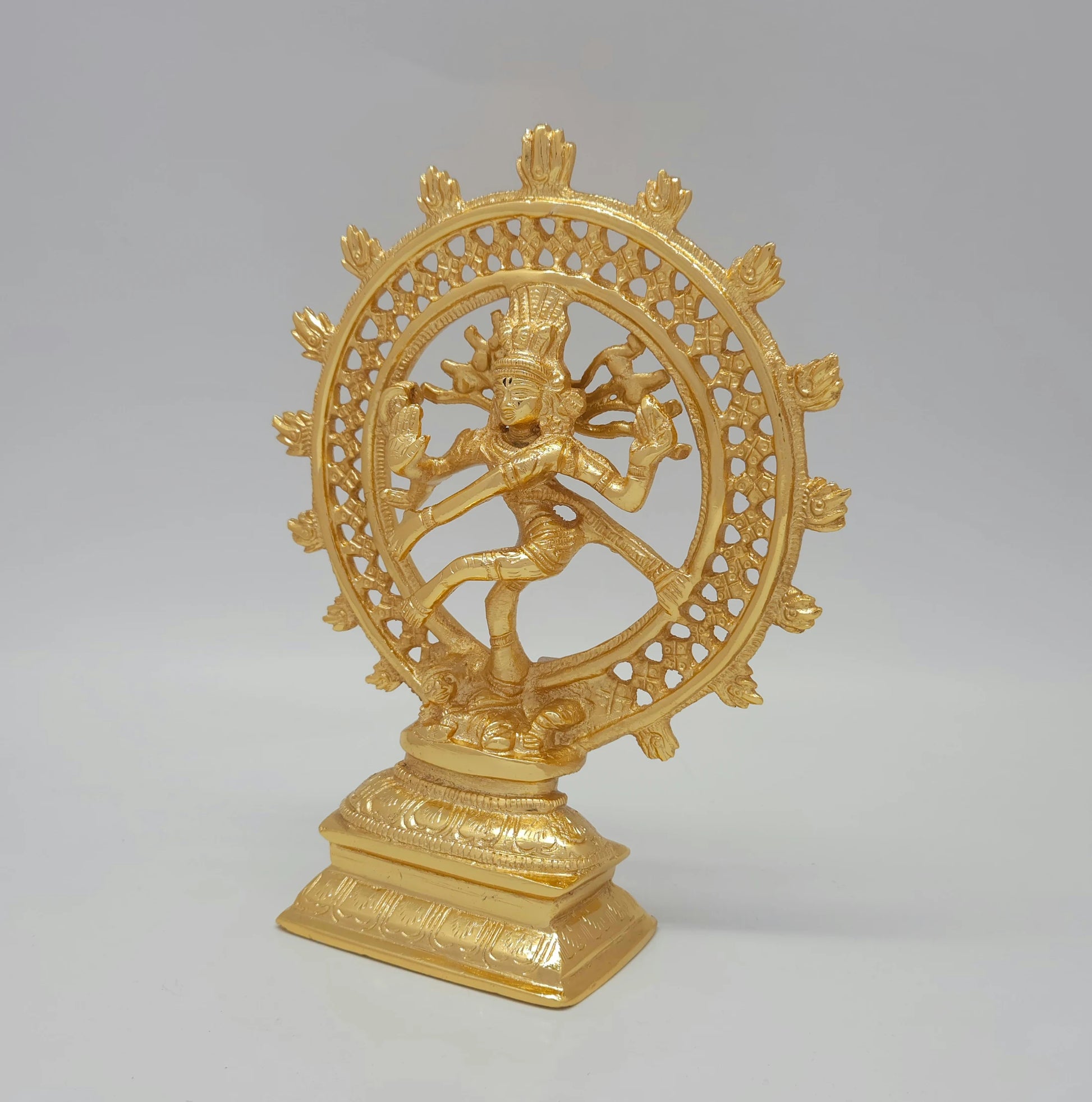 Premium Brass Shiva Tandava cosmic dance statue gold powder coated finish 8-Inch height 45-degree front left view highlighting damaru drum abhaya mudra hand and jata detail
