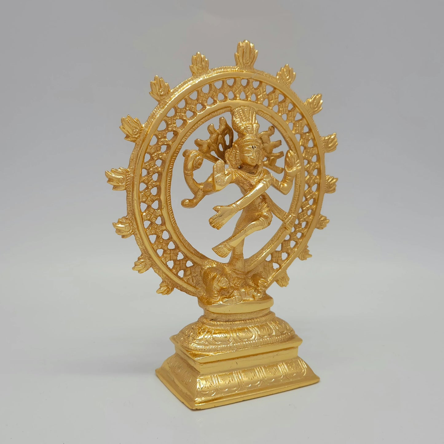 Premium Brass Shiva Tandava cosmic dance statue gold powder coated finish 8-Inch height 45-degree front right view showing raised gaja hasta leg and extended rectangular base