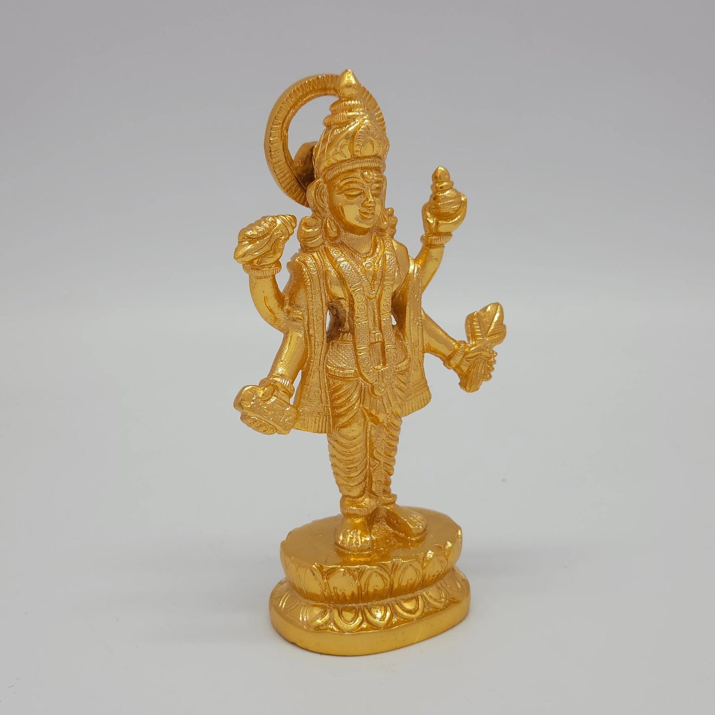 Premium Brass standing Lord Dhanvantari statue 6 inch 15cm 45 degree front right corner view focusing on amrita kalash nectar pot