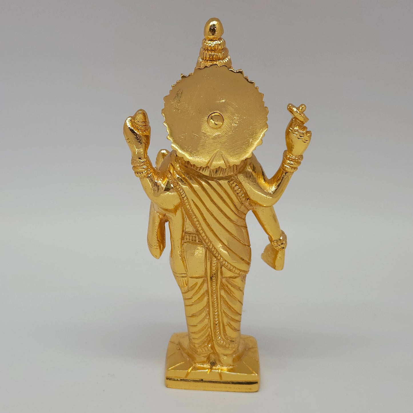 Premium Brass standing Lord Dhanvantari statue 7.5 inch 19cm back view showing reverse of the shoulders and fluted sirachakra halo disc