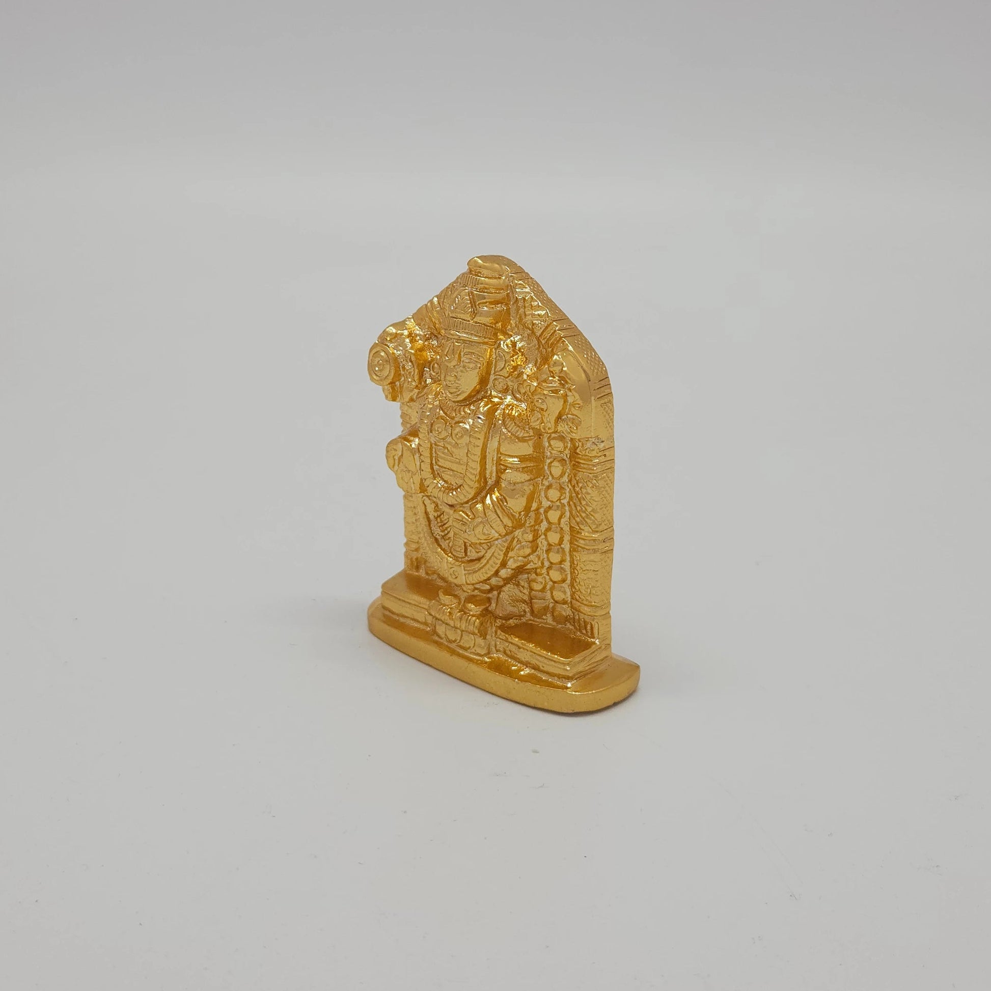 Premium Brass Lord Venkateswara statue 7.5cm 45 degree front right corner view focusing on conch shell and base thickness