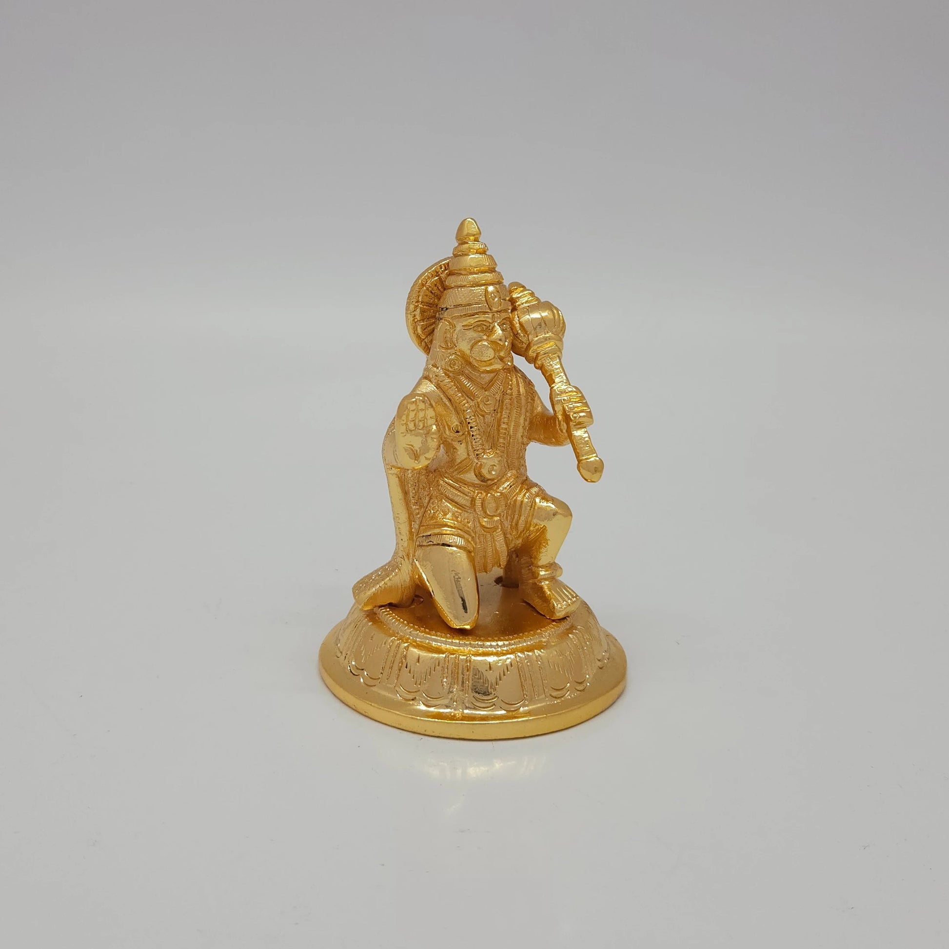 Premium Brass Veera Hanuman statue 4 inch 10cm 45 degree front left corner view highlighting abhaya mudra hand and fanned crown profile