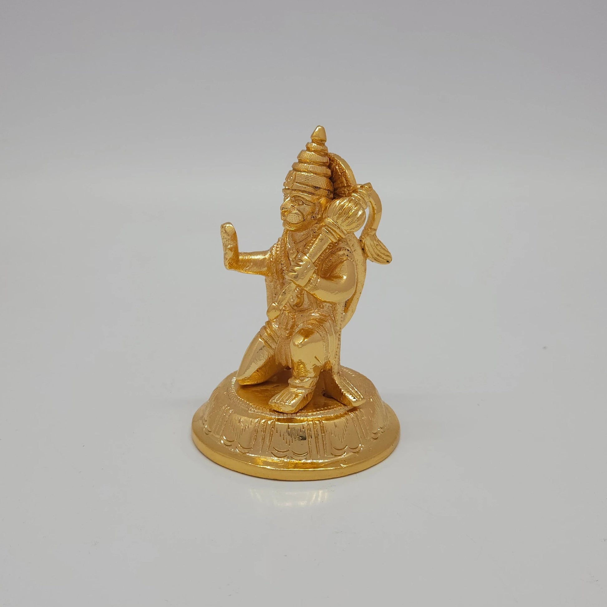 Premium Brass Veera Hanuman statue 4 inch 10cm 45 degree front right corner view focusing on propped gada mace detail